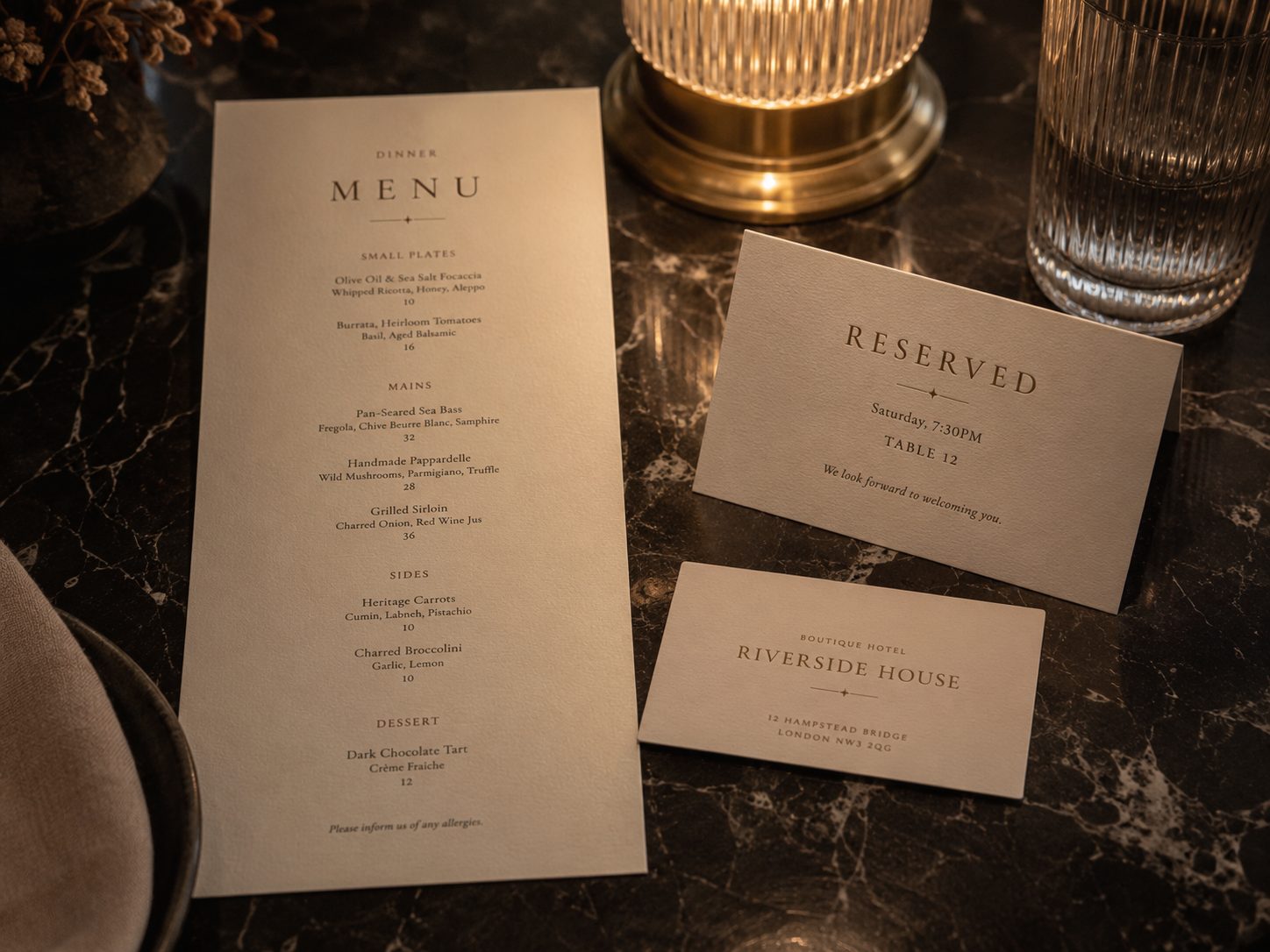 Restaurant menu and reservation cards on marble