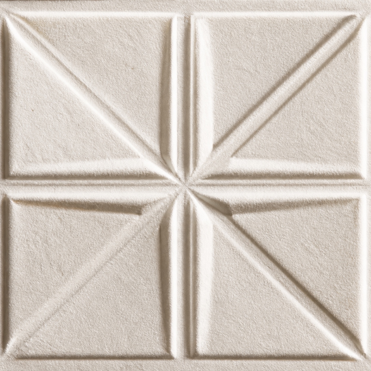 Raised relief across a textured paper surface