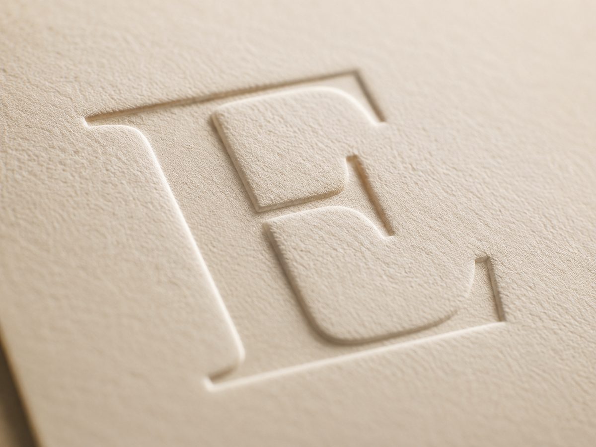 A letterpressed initial pressed deep into fine stock